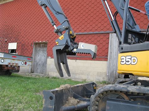 mini excavator crane attachment|attachments for mini excavators.